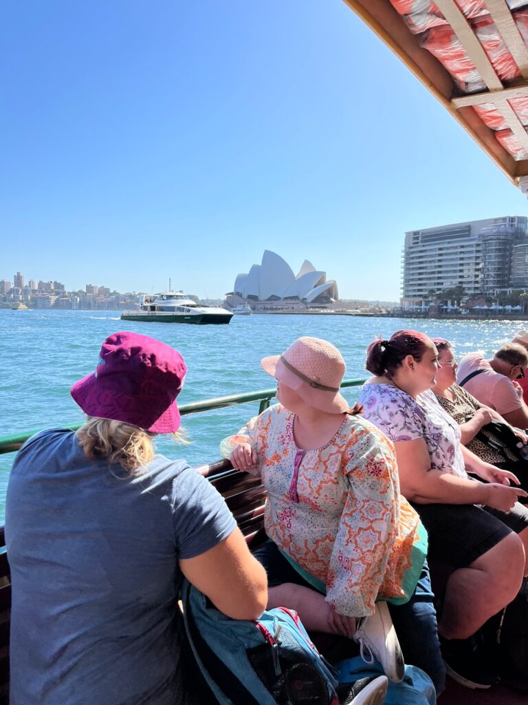 Group activity participants with Shine Social on a boat