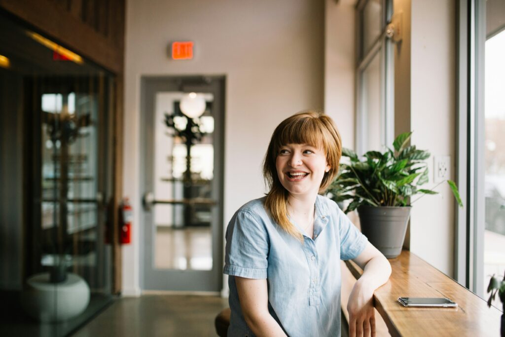 Woman sitting at a counter smiling 